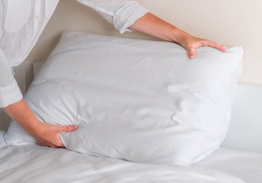 girl cleans the bedroom. Makes the bed after sleep. House cleaning, daily cleaning concept, cleaning service